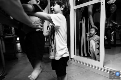 A Cuiaba, Brazil documentary family photographer recorded this image with layers of mess in BW