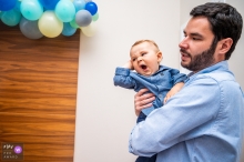 Campinas Sao Paulo father and his son at a party with blue balloons