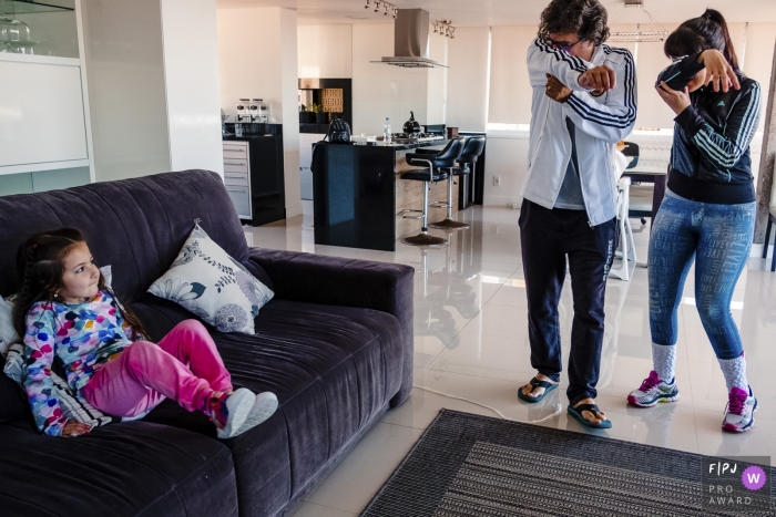Photo by: <a href="https://www.fpja.com/documentary-family-photography-contests/renato-mello/rio-grande-do-sul/2066386">Renato Mello - Brazil</a> A mother and father pretend to have elephant trunks as their daughter watches in this Family Photojournalist Association awarded photo by a Rio Grande do Sul, Brazil documentary family photographer.