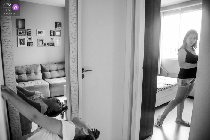 Photo by: <a href="https://www.fpja.com/documentary-family-photography-contests/waleska-battistella/rio-grande-do-sul/2066551">Waleska Battistella - Brazil</a> A mother watches her son playing around in front of a mirror in this image created by a Rio Grande do Sul, Brazil family photographer.