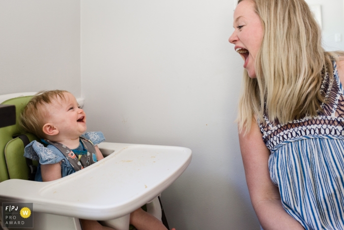 Los Angeles family photojournalist captured this image of a baby and mom laughing together