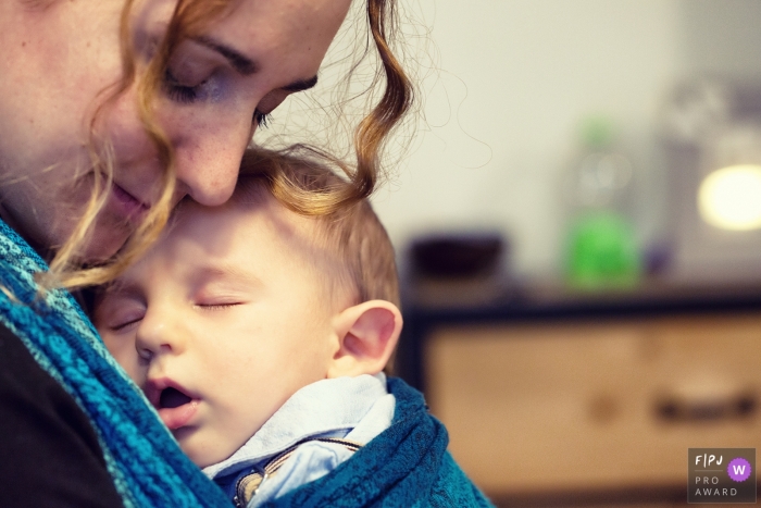 Photo by: <a href="https://www.fpja.com/documentary-family-photography-contests/massimiliano-beccati/milan/2087271">Massimiliano Beccati - Italy</a> Lombardy documentary family photographer captured this photo of an infant sleeping peacefully in sling on his mothers chest