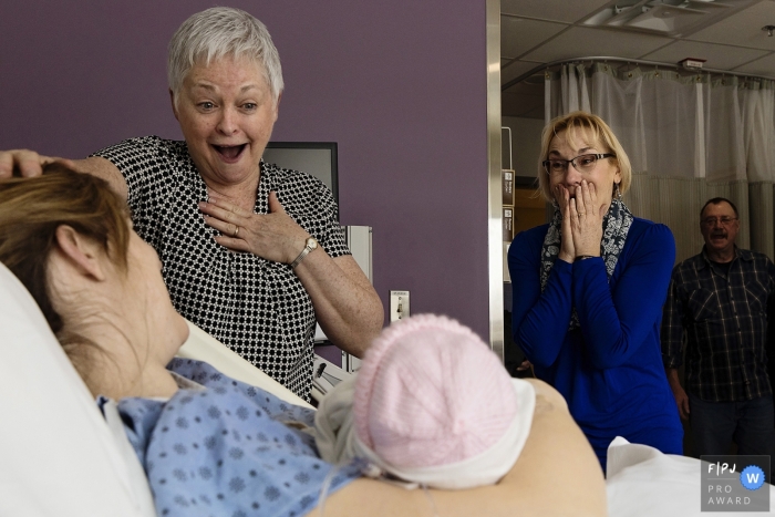 Ontario documentary family photographer captured this emotional photo of the grandparents meeting the new baby for the first time