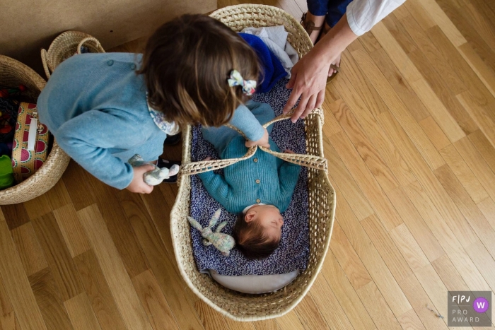 Paris family photojournalist - newborn baby at home with big sister