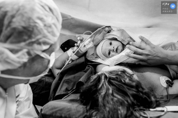 Photo by: <a href="https://www.fpja.com/documentary-family-photography-contests/marjolein-roossien/groningen/2099680">Marjolein Roossien - Netherlands</a> Groningen hospital birthing photos from the Netherlands - hello new world - new baby is here with eyes wide open