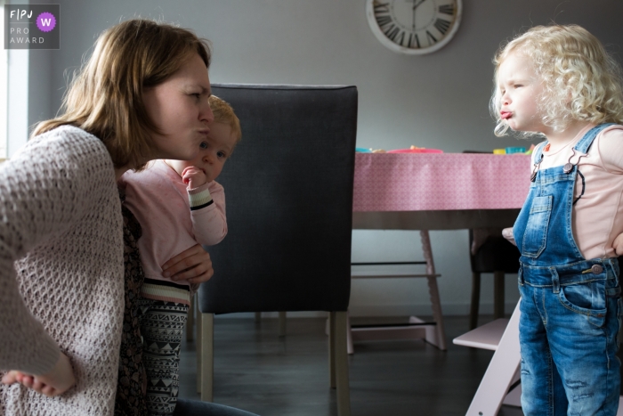 Photo by: <a href="https://www.fpja.com/documentary-family-photography-contests/natasja-de-nijs/breda/2099887">Natasja de Nijs - Netherlands</a> Breda, Noord Brabant documentary family photos of daughter and mom making funny faces at each other.