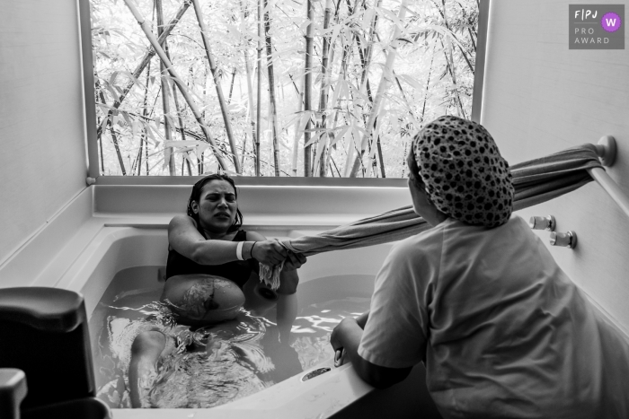 Rio de Janeiro, Brazil birthing photography of mom in a birth tub of water.