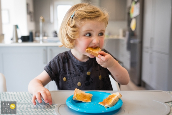 Cambridgeshire Family Photographer - England Lunch for Young Girl at the Table.