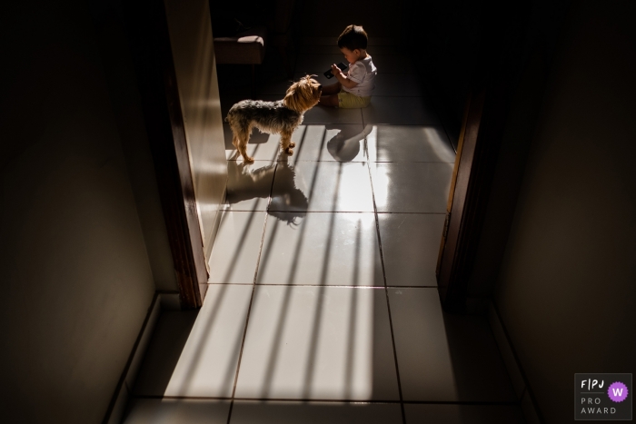 Pernambuco documentary family photo session - Recife boy and his best friend, the dog.