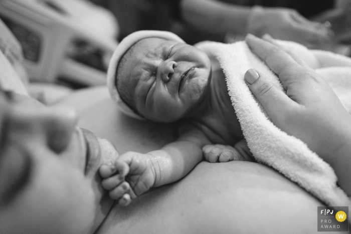 Washington family birthing photography of newborn baby on mother's chest in Seattle 	