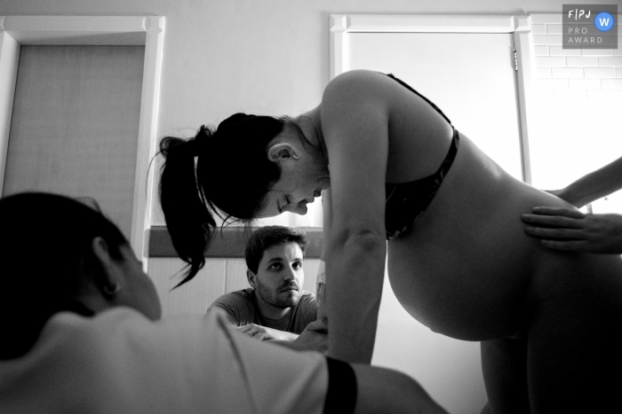 Photo by: <a href="https://www.fpja.com/documentary-family-photography-contests/thiago-braga/florianopolis/2101399">Thiago Braga - Brazil</a> Santa Catarina birthing photography on the day of birth, with a look at the father and his tensions.