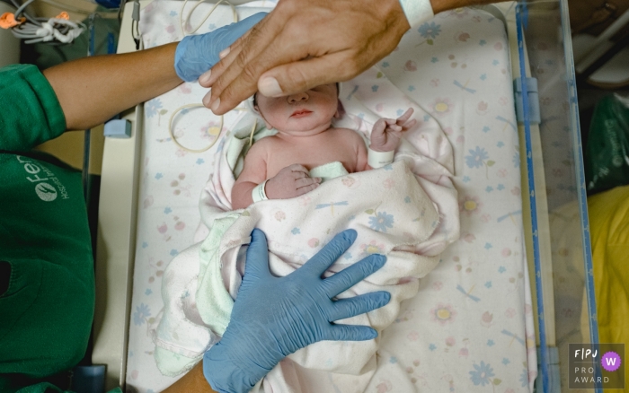 Mato Grosso newborn baby at the hospital nursery department. Dad and baby photography.