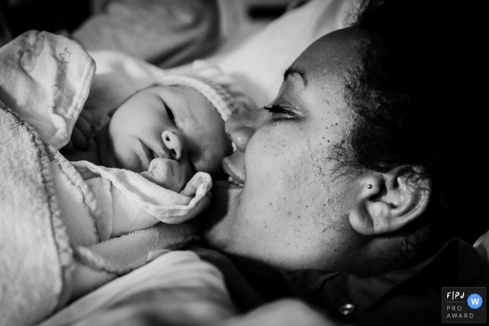 Mother finally meeting her son for the first time after a c-section under full anesthesia | Netherlands Birth Photography