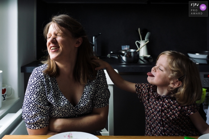 Photo by: <a href="https://www.fpja.com/documentary-family-photography-contests/marine-poron/paris/2101793">Marine Poron - France</a> Mother and daughter in the kitchen of every day life | Paris Family Session