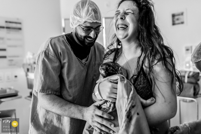 Mother is elated with the birth of a new child with father by their side | Sao Paulo Birthing