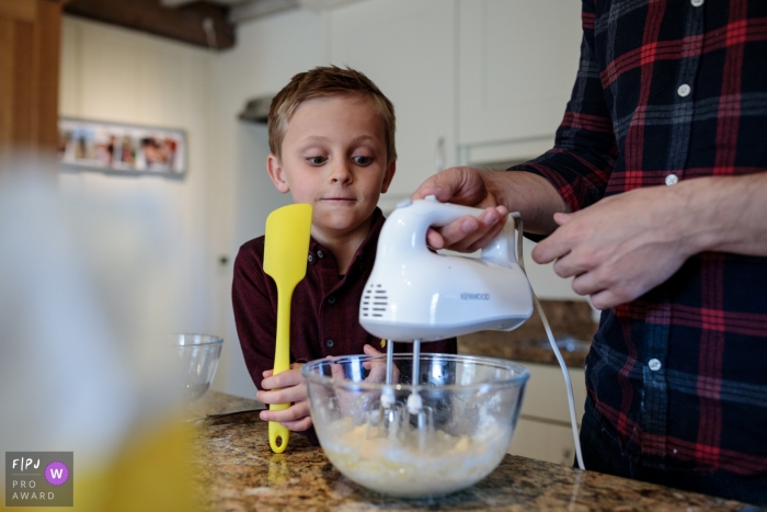 Kent England father and son enjoy some cake baking during home photography session designed for families