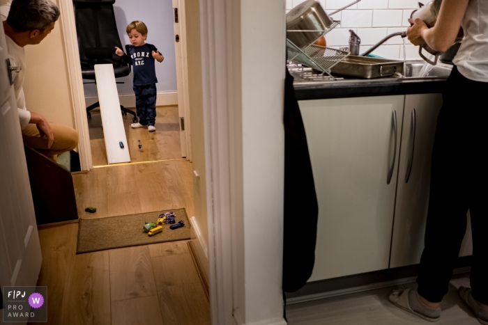 London, England in-home family photography session - Boy playing with little cars