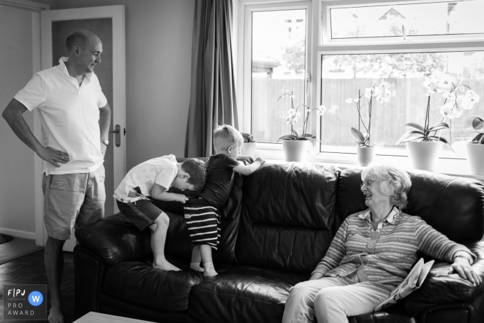 Family - big brother checking little brother's nappy | Cambridgeshire Family Photography