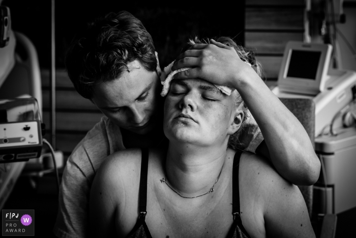 Photo by: <a href="https://www.fpja.com/documentary-family-photography-contests/marjolein-roossien/groningen/2104263">Marjolein Roossien - Netherlands</a> Groningen Netherlands mother endures the Hard work of delivering a baby