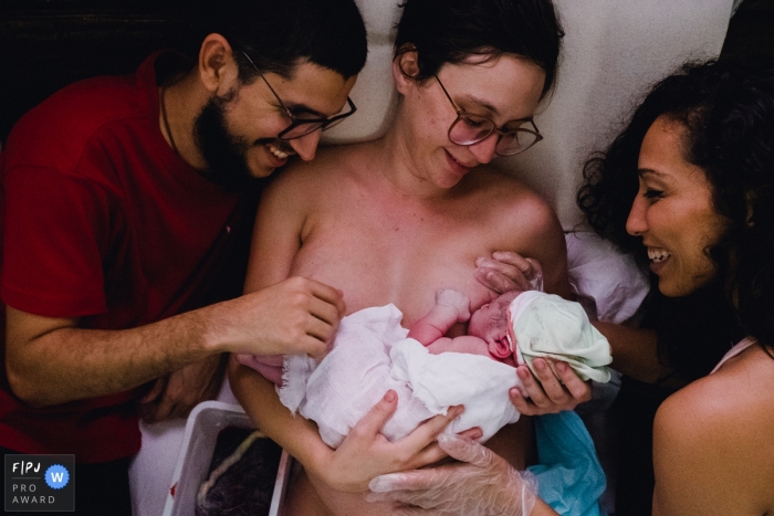 Photo by: <a href="https://www.fpja.com/documentary-family-photography-contests/marcos-paulo/sao-paulo/2104583">Marcos Paulo - Brazil</a> Sao Paulo Brazil first nursing session after delivering the baby