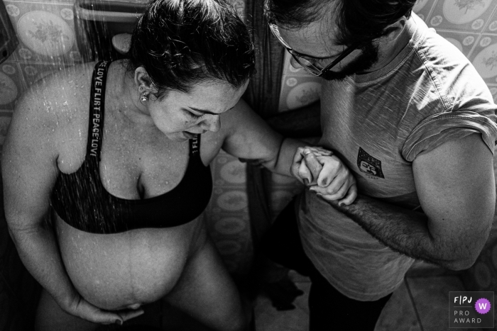 Sao Paulo Brazil mother and father in the shower during a home birth session