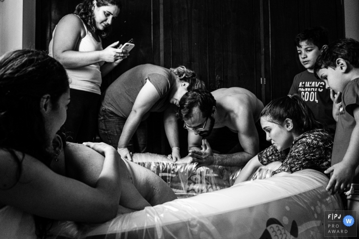 Sao Paulo Brazil family waits for the delivery during an at home water birth