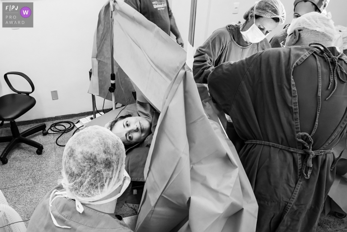 The mother looking at her husband while the medical team starts the surgery at Hospital Unimed