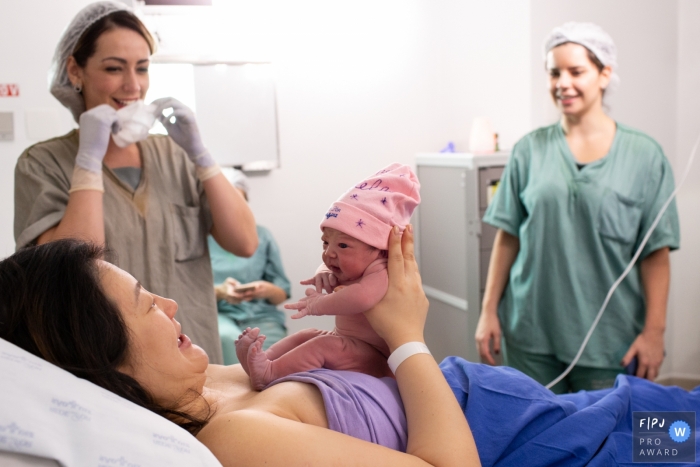 Sao Paulo mother looks face-to-face with her new baby at Maternidade São Luiz 