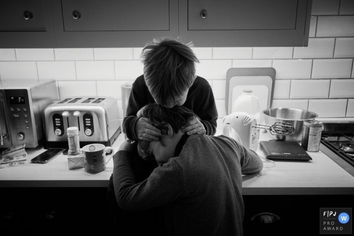 Dorset Family photo of a younger uncle hugging older nephew 