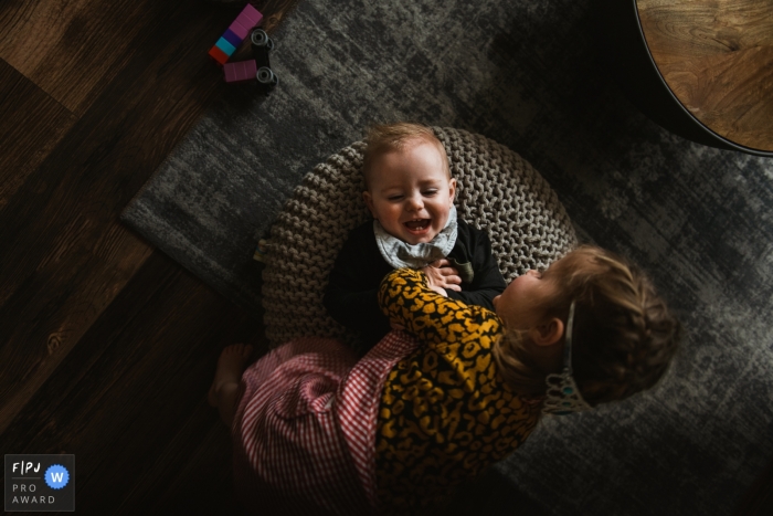 Amsterdam Noord Holland siblings Playing together at home