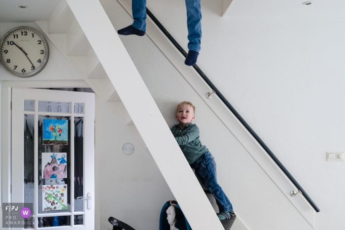 Zuid Holland Netherlands Boy is just hanging around the stairs at home