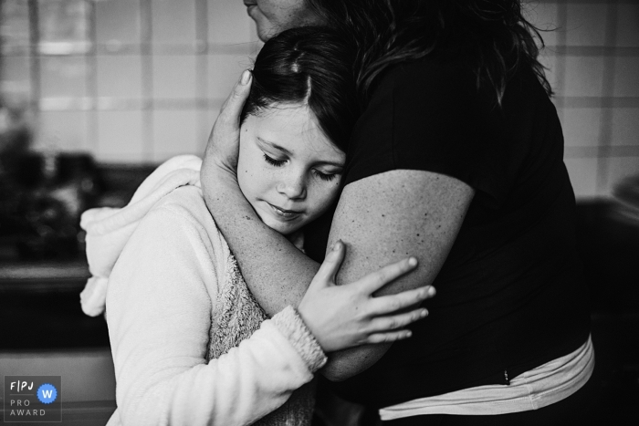 Photo by: <a href="https://www.fpja.com/documentary-family-photography-contests/jolanda-boer/drenthe/2103793">Jolanda Boer - Netherlands</a> Drenthe Netherlands Girl hugging her mom after she had a fight with her brother