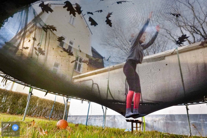 Dusseldorf North Rhine-Westphalia Girl on a trampoline jumping in the backyard