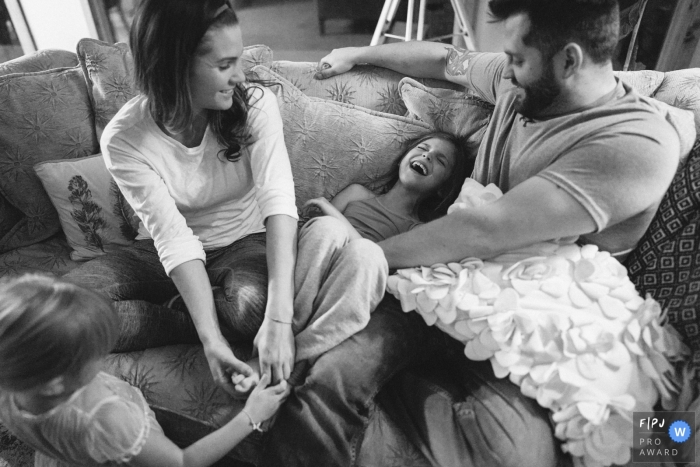 Photo by: <a href="https://www.fpja.com/documentary-family-photography-contests/ron-storer/seattle/2104879">Ron Storer - United States</a> Seattle Washington family time on the couch