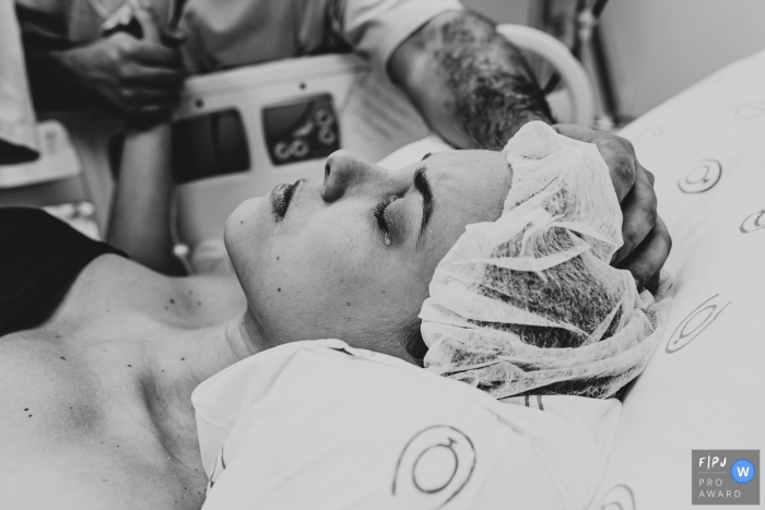 Sao Paulo Brazil birth photography mom crying in labor at hospital.