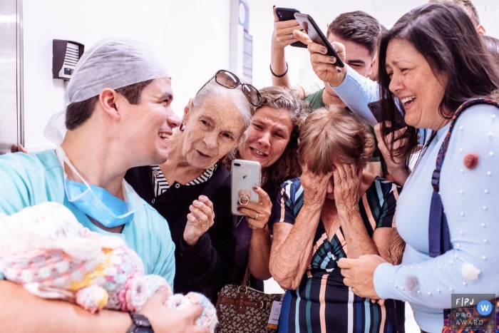 Grandma is set off with emotion at the sight of her new grandchild | Rio de Janeiro birth and family photographer