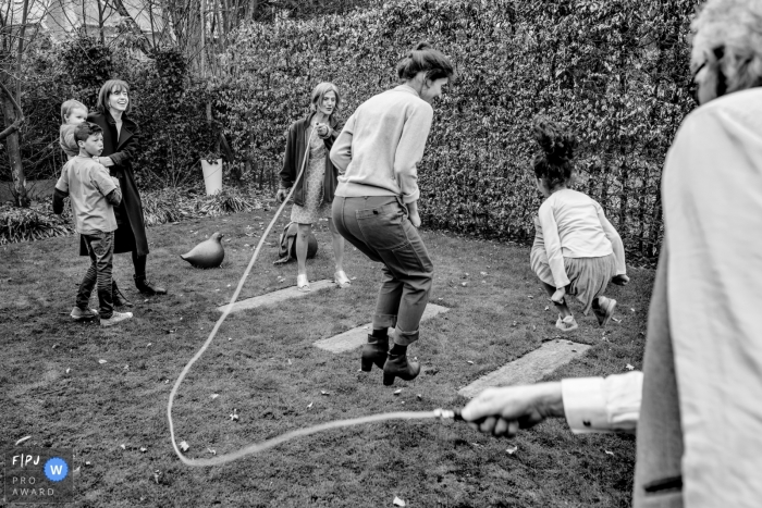 Photo by: <a href="https://www.fpja.com/documentary-family-photography-contests/kobe-vanderzande/limburg/2104925">Kobe Vanderzande - Belgium</a> Limburg Flanders family photography of some backyard fun with a jump rope and heels