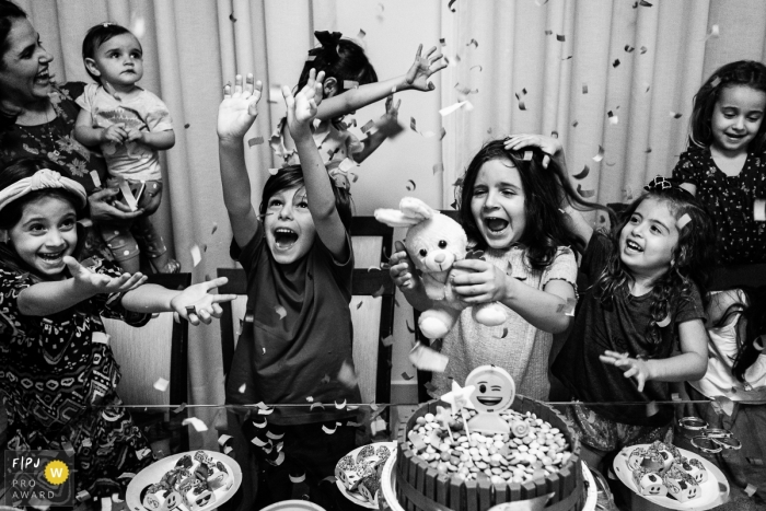 Photo by: <a href="https://www.fpja.com/documentary-family-photography-contests/marcos-paulo/sao-paulo/2106119">Marcos Paulo - Brazil</a> Kids having a blast during a birthday party with lots of confetti flying | Sao Paulo birthday party photographer