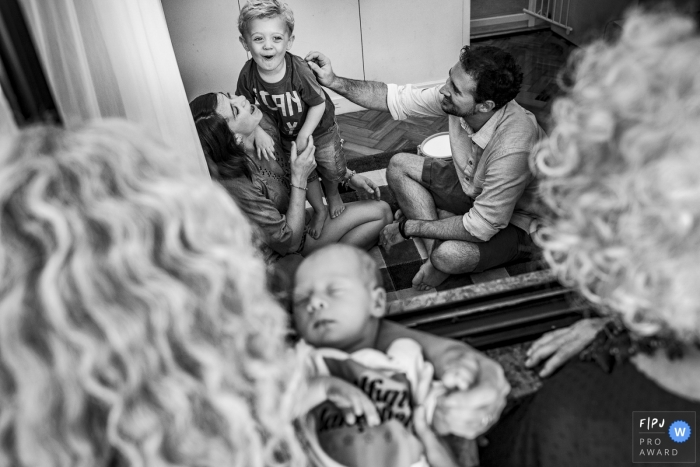 Photo by: <a href="https://www.fpja.com/documentary-family-photography-contests/clara-sampaio/rio-de-janeiro/2106256">Clara Sampaio - Brazil</a> Having the love and presence of the two grandmothers is one of the best things in life! | Brazil family photo