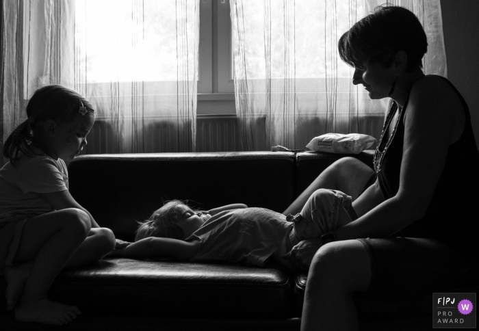 Photo by: <a href="https://www.fpja.com/documentary-family-photography-contests/gabriella-feyer/nimes/2107767">Gabriella Feyer - France</a> Gard Documentary Family Photographer | mother changes diaper, an everyday moment