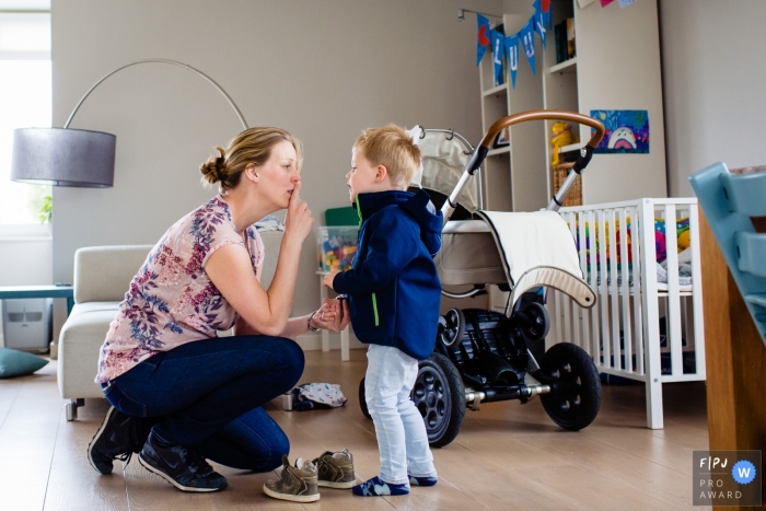 Photo by: <a href="https://www.fpja.com/documentary-family-photography-contests/moniek-van-gils/noord-brabant/2107866">Moniek van Gils - Netherlands</a> Noord Brabant Family photo of mom saying to be quiet for the baby who's sleeping