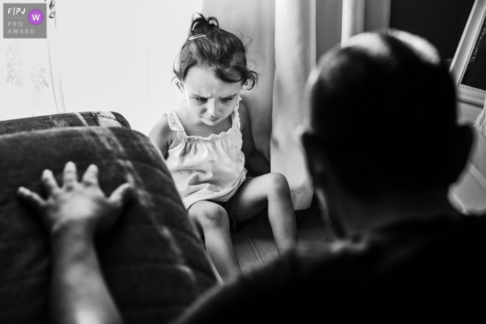 Istanbul Documentary Family photo of a sad daughter playing with her father 