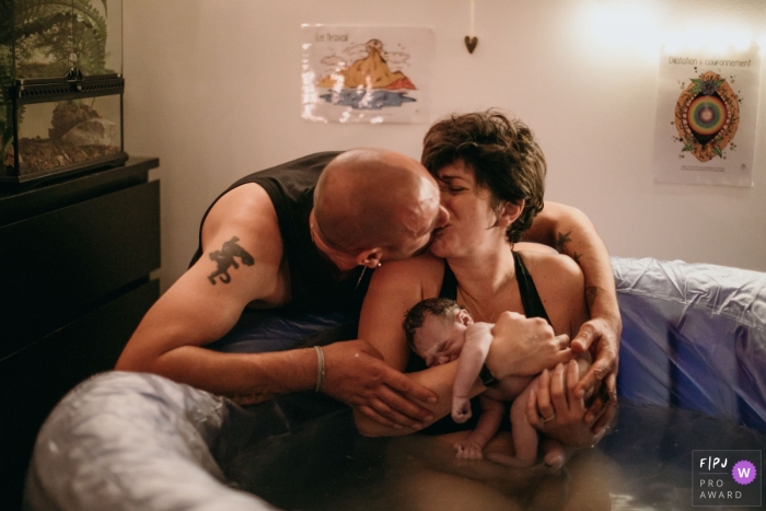 Haute Savoie home birth photographer captures the love and happiness of this couple after their new baby was just bornin France