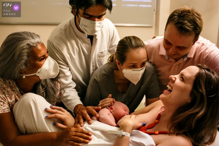 Photo by: <a href="https://www.fpja.com/documentary-family-photography-contests/adriana-costa/belo-horizonte/2109125">Adriana Costa - Brazil</a> BH documentary-style natural birth photo session captures he woman's joy and fulfillment, showing thanks to the team for the excellent assistance during her natural birth in Brazil