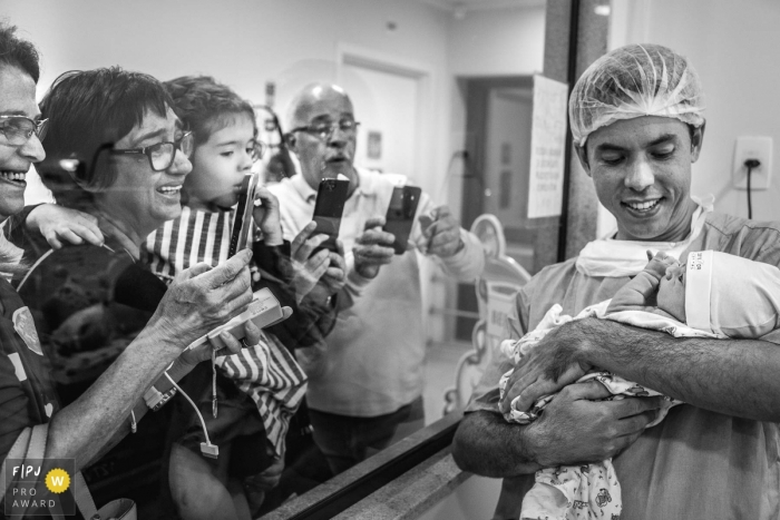 Brazil family pictures from hospital birth photo shoot in black and white with day saying: The world needs to know!	