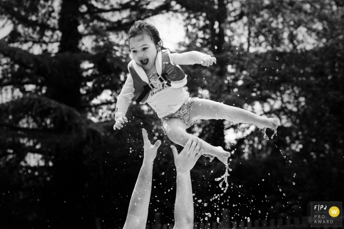 Valencia Spain family photo of a flying Swimming kid in black and white