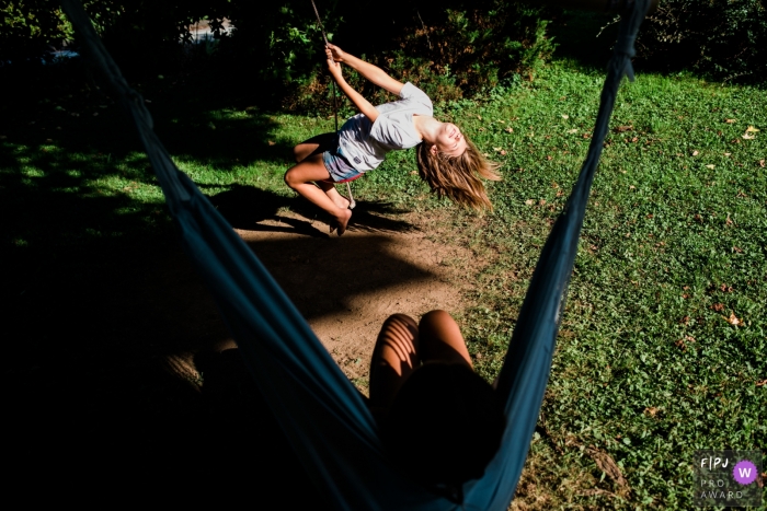 Ljubljana Slovenia family photography showing some outdoor Enjoying summer fun in the yard