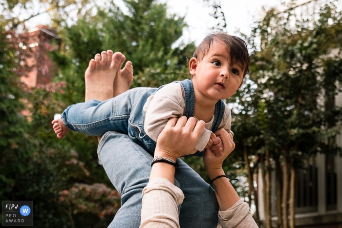 DC backyard fun family photography with a flying airplane baby toddler DC backyard fun family photography with a flying airplane baby toddler