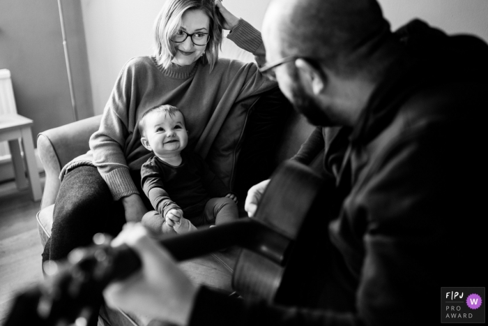 England musical documentary-style family photo shoot in Norfolk as a father serenades his baby girl