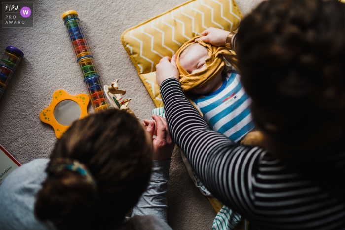 Photo by: <a href="https://www.fpja.com/documentary-family-photography-contests/rob-dodsworth/norfolk-uk/2109906">Rob Dodsworth - United Kingdom</a> England, UK newborn pictures from an at-home photo shoot with a baby on the changing mat